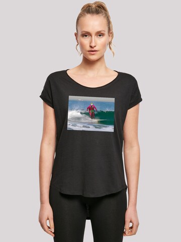 T-shirt 'Batman TV Series Joker Surfing' F4NT4STIC en noir : devant