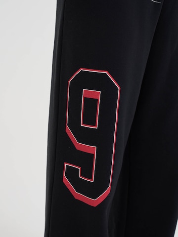 AND1 Široke hlačnice Hlače | črna barva