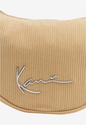 Borsa a spalla di Karl Kani in beige