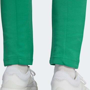 ADIDAS SPORTSWEAR Tapered Workout Pants 'Future Icons Badge Of Sport' in Green