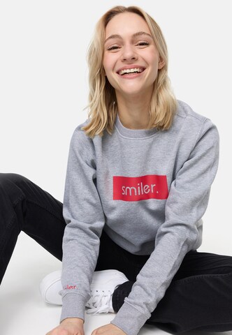 Sweat-shirt smiler. en gris