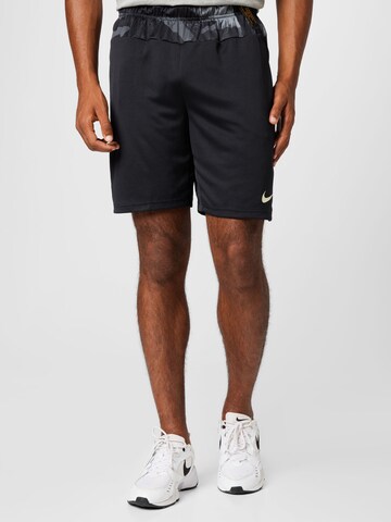 NIKE Regular Sports trousers in Black: front