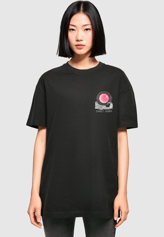 Merchcode Oversizeshirt 'Sunset Charm' in Schwarz: Vorderseite