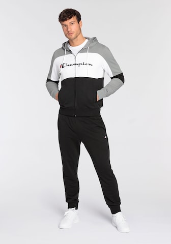 Champion Authentic Athletic Apparel Tracksuit in Black: front