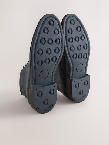 Next - Botas con cordones en negro