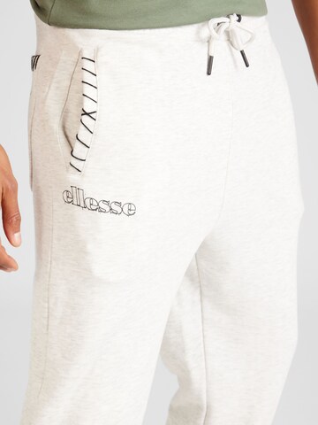 ELLESSE - Tapered Calças de desporto 'Nevica' em branco