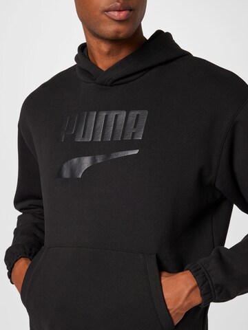 PUMA Sweatshirt 'PUMAxABOUT YOU' in Schwarz