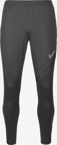 NIKE Slim fit Workout Pants in Black: front