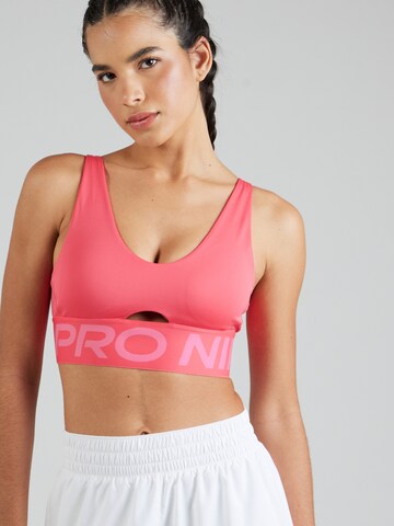 NIKE Bygelfri Sportbehå 'INDY PLUNGE ' i rosa