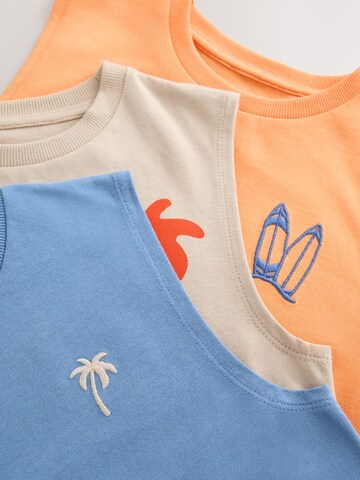 Tricou de la Next pe bej