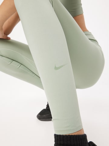NIKE Skinny Spodnie sportowe 'One Luxe' w kolorze zielony