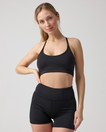 SNOCKS Skinny Sportbroek in Zwart: voorkant
