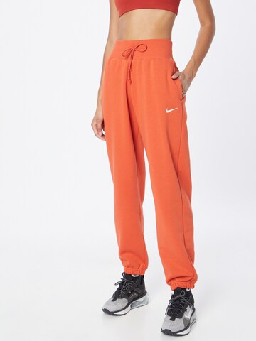 oranžinė Nike Sportswear Siaurėjantis Kelnės 'Phoenix Fleece': priekis