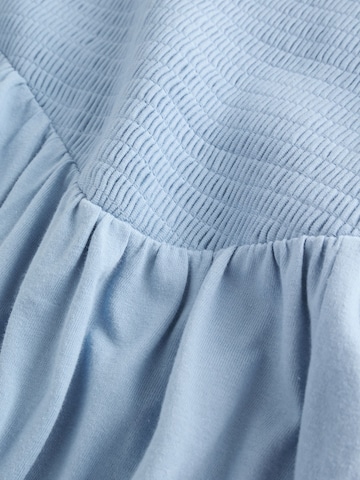 Next Mekko värissä sininen