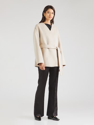 millane Tussenjas in Beige