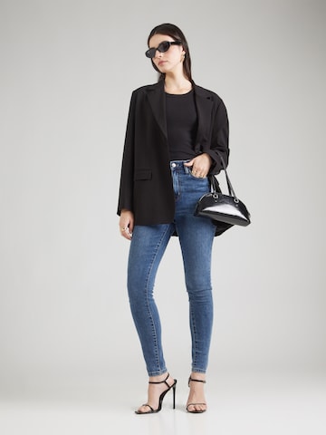 Skinny Jeans de la DKNY pe albastru