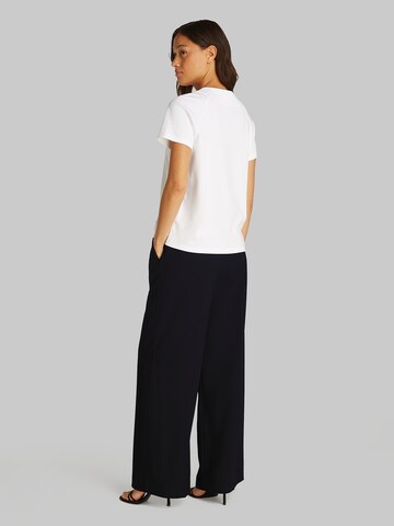 Wide leg Pantaloni con pieghe di Calvin Klein in nero