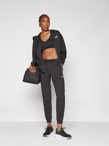 PUMA Tapered Sportbroek 'TAD Essential' in Zwart