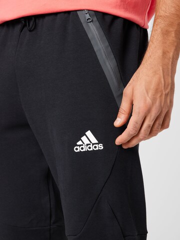 ADIDAS SPORTSWEAR Дънки Tapered Leg Спортен панталон 'Designed For Gameday' в черно