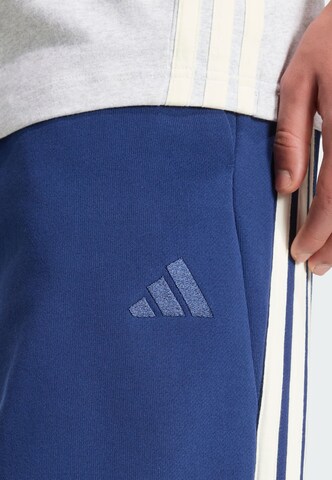 ADIDAS SPORTSWEAR Loosefit Urheiluhousut värissä sininen