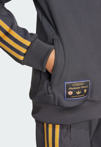 Veste mi-saison 'Manchester United Terrace Icons' ADIDAS ORIGINALS en noir