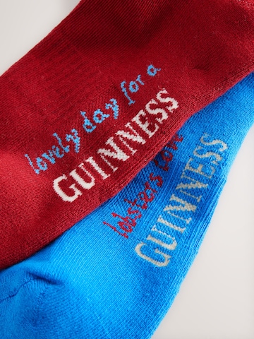 Șosete 'Guinness Licence' de la Next pe roșu