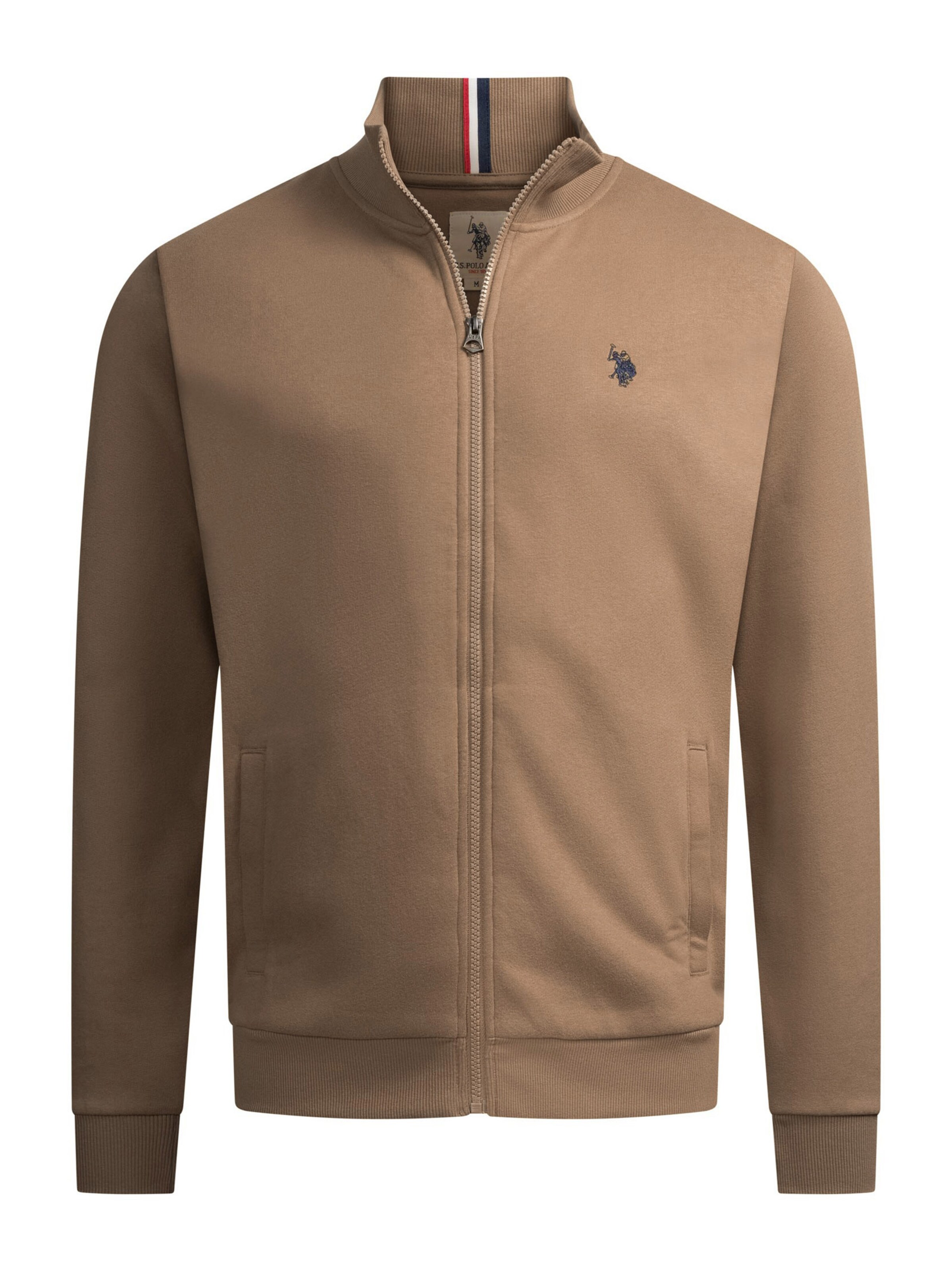 Veste de survêtement U.S. POLO ASSN. en beige : devant