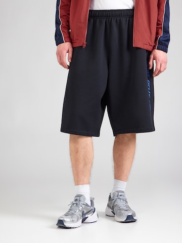 Baggy Pantalon 'CLUB' Nike Sportswear en noir : devant