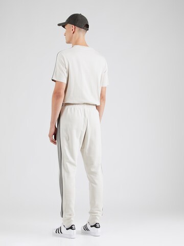 ADIDAS SPORTSWEAR - Tapered Calças de desporto em bege
