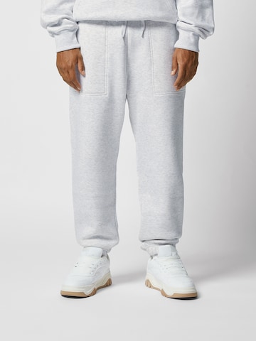 Bershka Tapered Trousers in Grey: front