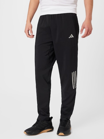 ADIDAS PERFORMANCE Tapered Sportbroek 'Own The Run Astro' in Zwart: voorkant