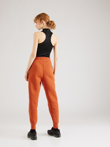 Nike Sportswear Zúžený Kalhoty 'TCH FLC' – oranžová