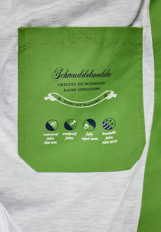 Schmuddelwedda Toiminnallinen pitkä takki värissä vihreä