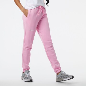 Tapered Pantaloni di new balance in rosa