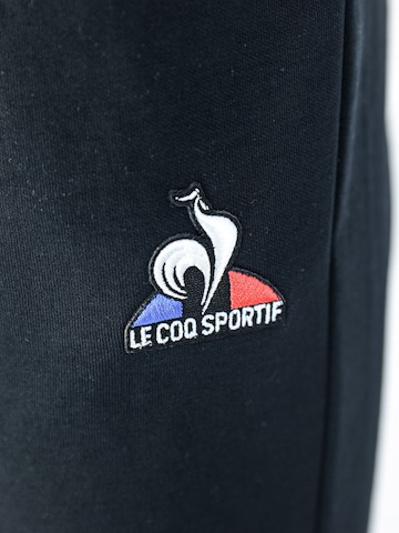 Regular Pantalon de sport LE COQ SPORTIF en noir