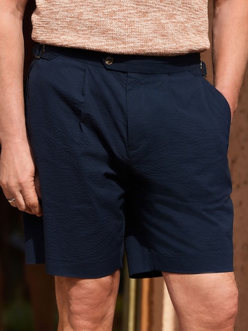 Slimfit Pantaloni con pieghe di Next in blu