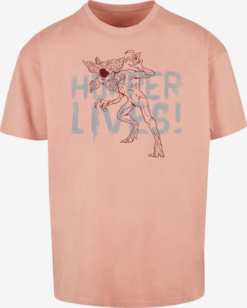 F4NT4STIC T-Shirt 'Stranger Things Hoppers Live Netflix TV Series' in Pink: predná strana