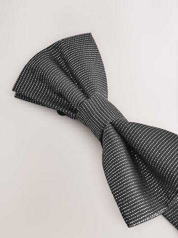 Next Fliege in Silber