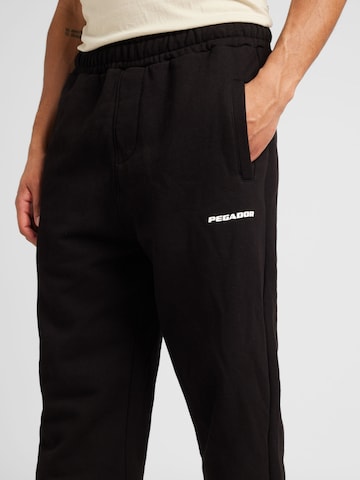 Effilé Pantalon Pegador en noir