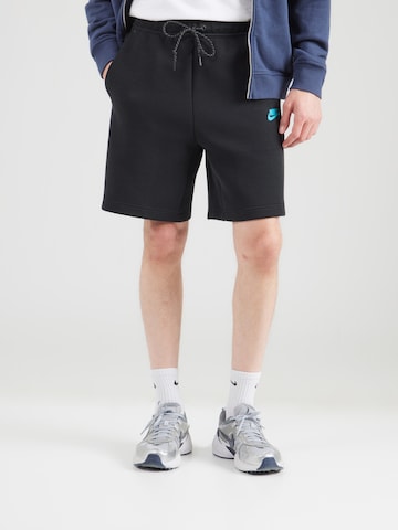 Regular Pantalon 'TCH FLC' Nike Sportswear en noir : devant