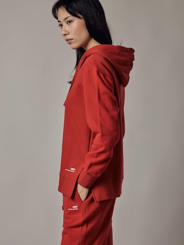 Felpa 'Felpa Felpata con Cappuccio e Spacchi Laterali' di OWN Off With Nature in rosso