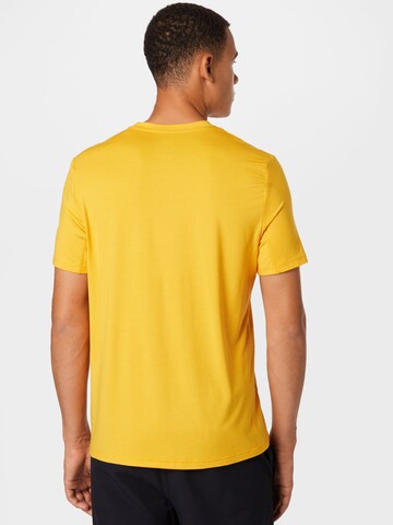 Reebok - Camiseta funcional en amarillo