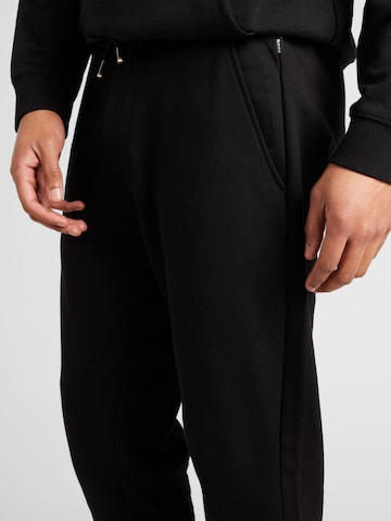 Tapered Pantaloni 'Lamont' di BOSS Black in nero