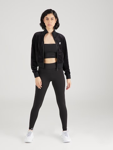 Bluză cu fermoar sport 'COUTURE' de la GUESS pe negru