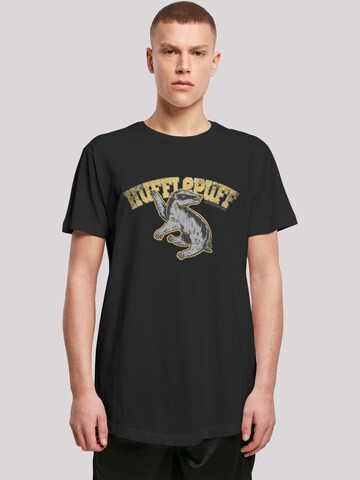Maglietta 'Harry Potter Hufflepuff Sport Emblem' di F4NT4STIC in nero: frontale