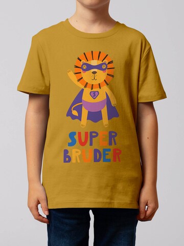 watabout.kids T-Shirt 'Löwe Superbruder' in Gelb: Vorderseite