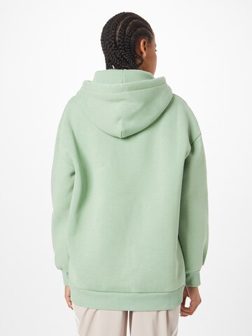 Karl Kani Sweatshirt 'KW224-055-2 KK Small Signature' i grønn