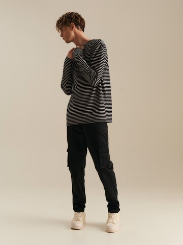 About You x Nils Kuesel Tapered Pants 'Iven' in Black