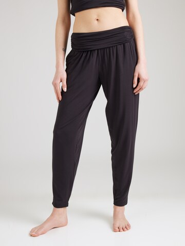 Tapered Pantaloni sportivi di CURARE Yogawear in nero: frontale
