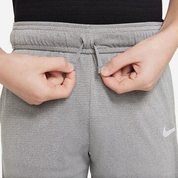 NIKE Regular Workout Pants 'POLY' in Grey